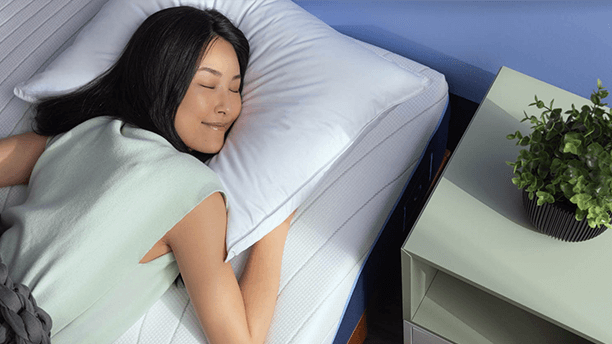 Woman peacefully sleeping on Octave Vista mattress