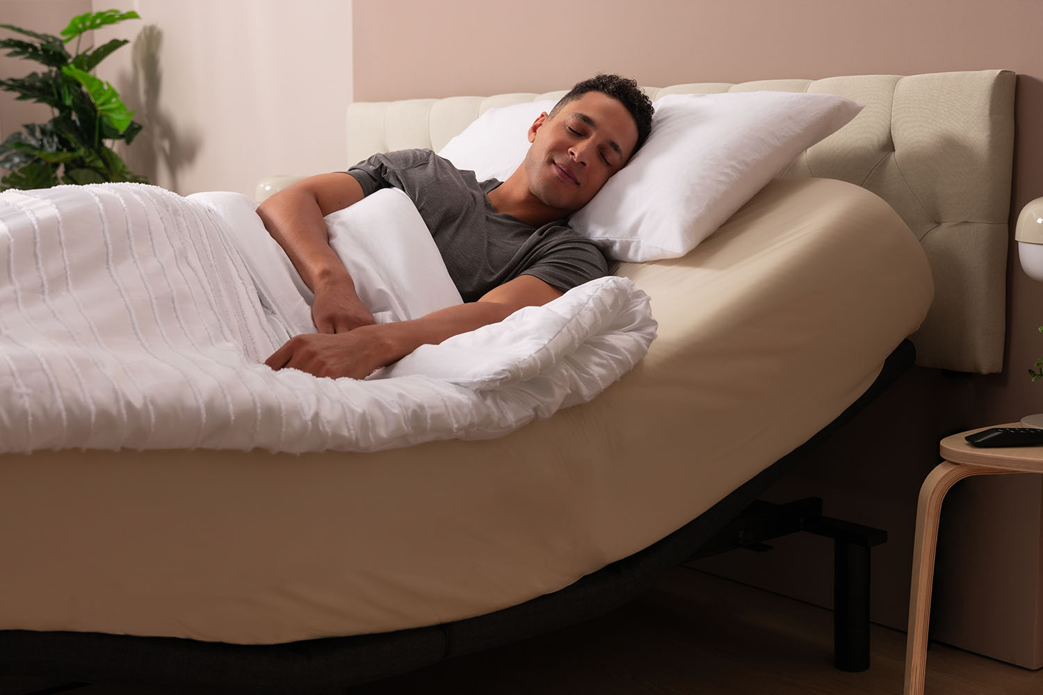 Man resting on an inclined Adjustable Bed