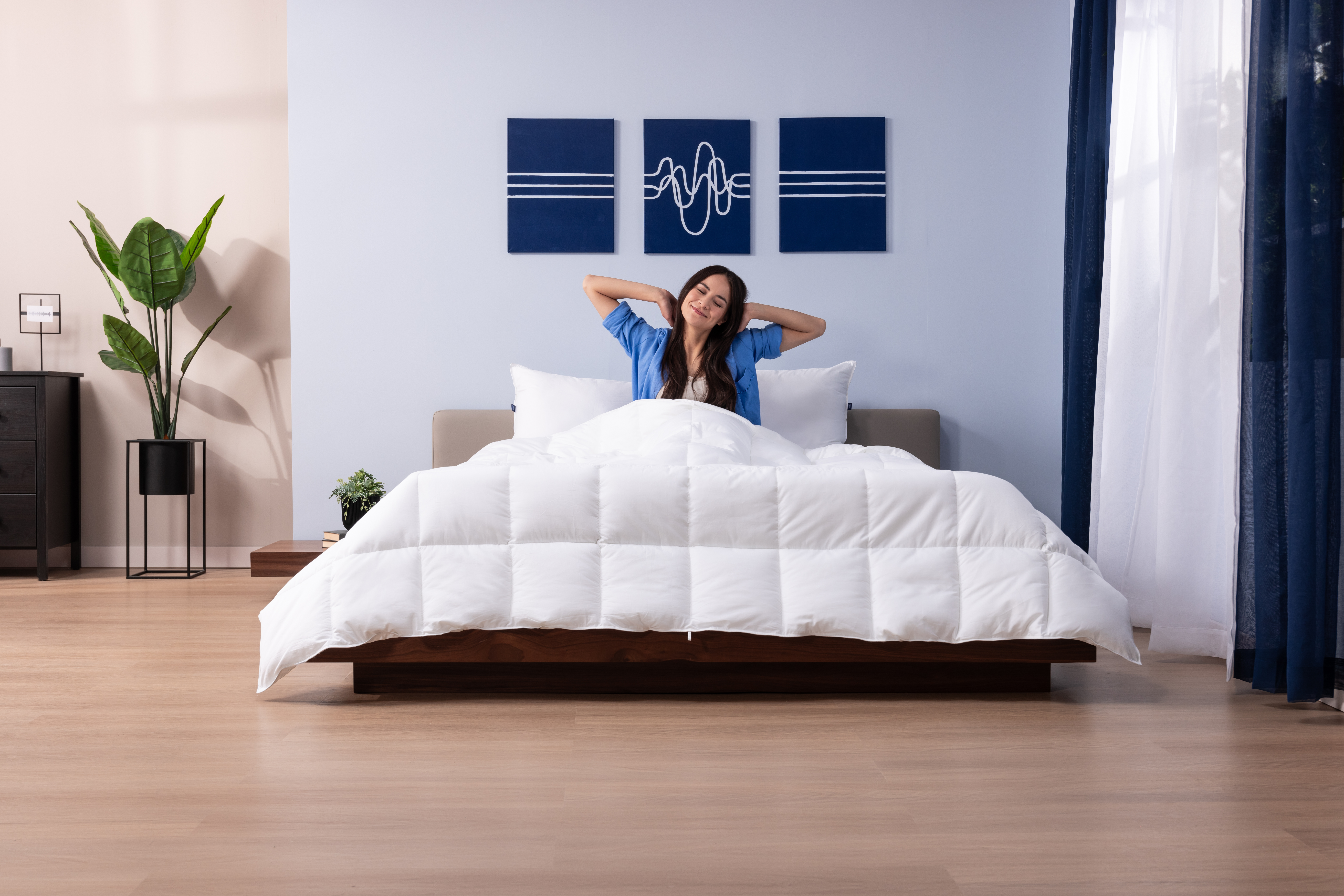 Woman waking up in bed with her Octave Duvet Value Pack