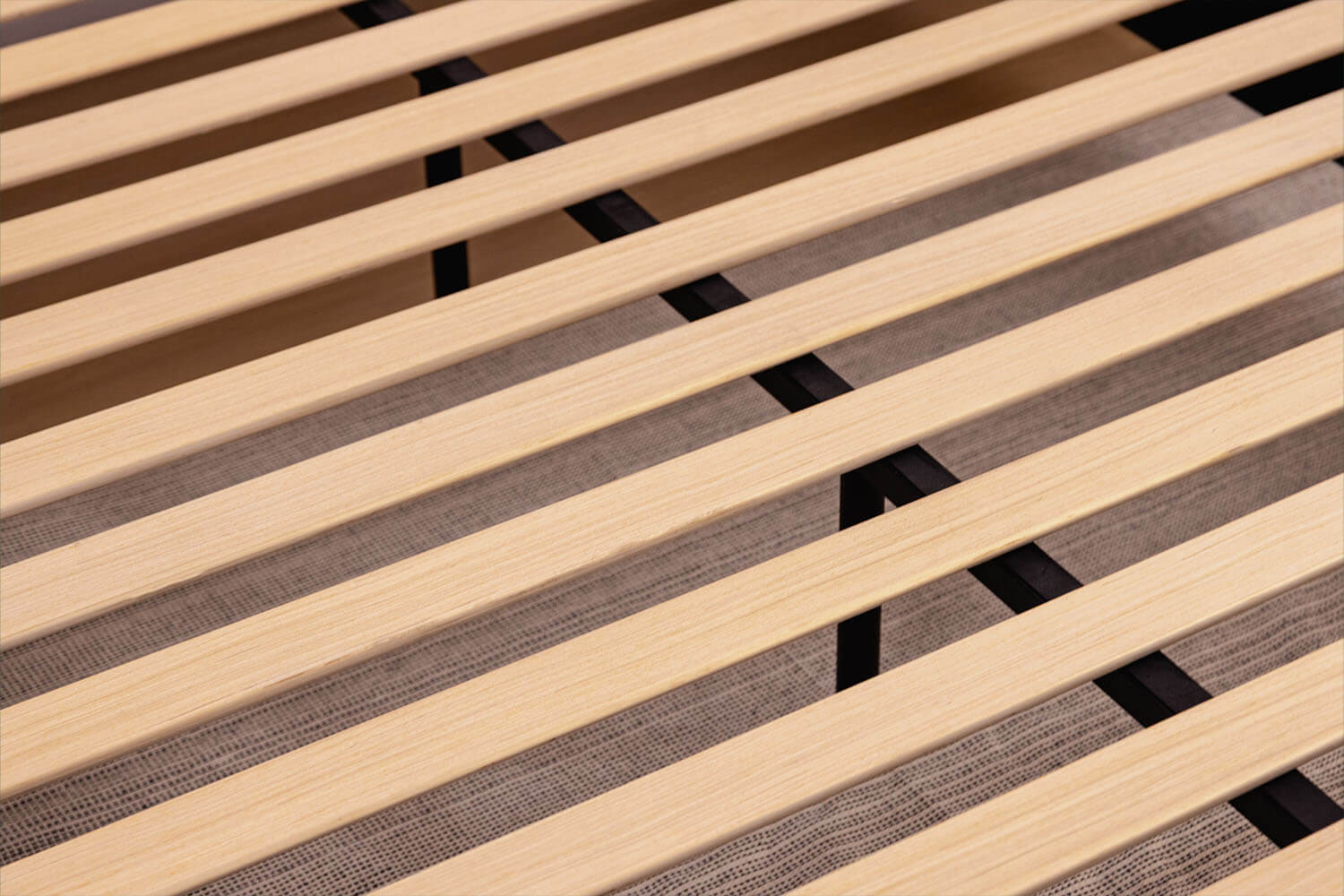 Detailed view of the wood slats and steel centre beam on the Platform Bed.