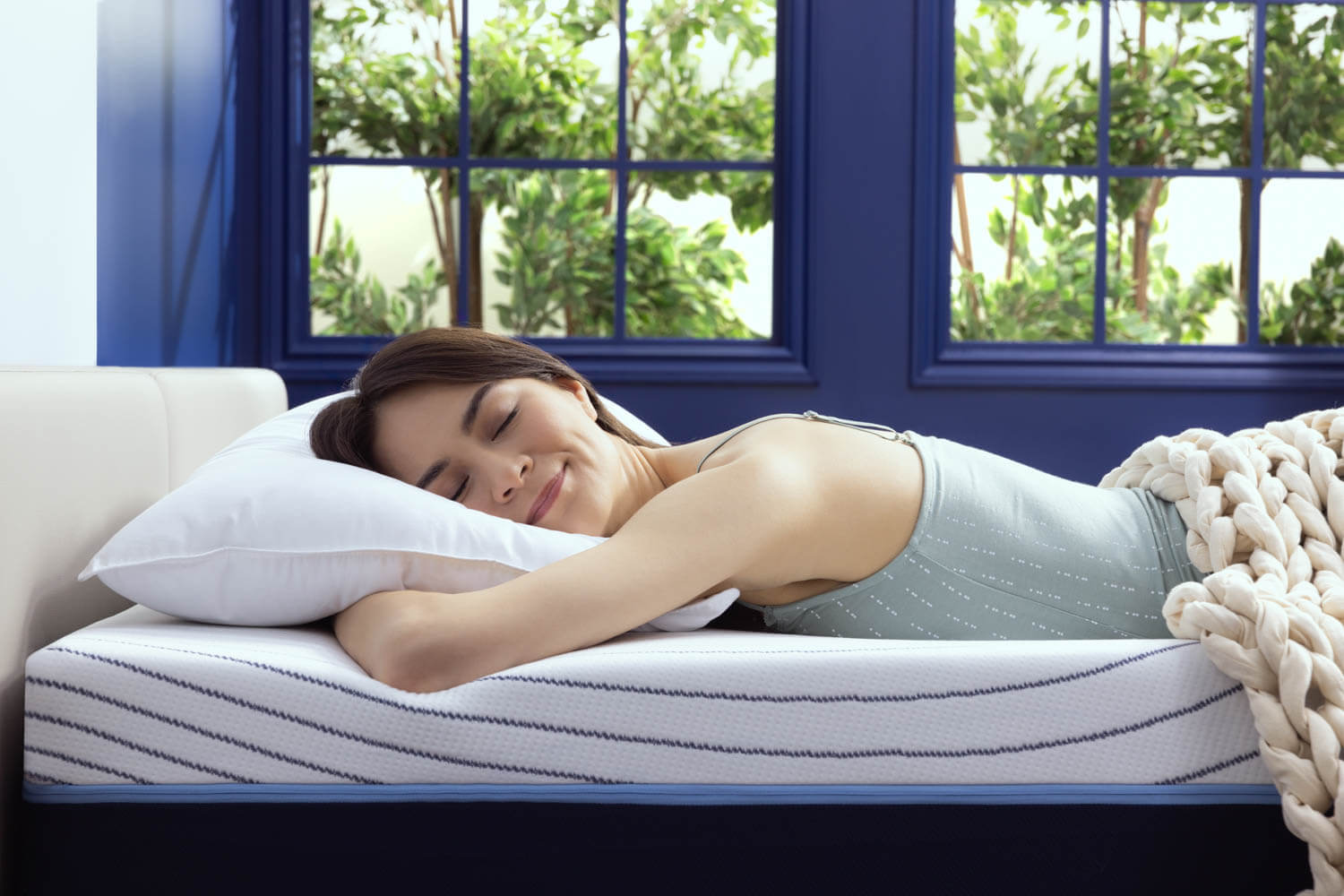 Woman peacefully sleeping on the Octave Horizon mattress