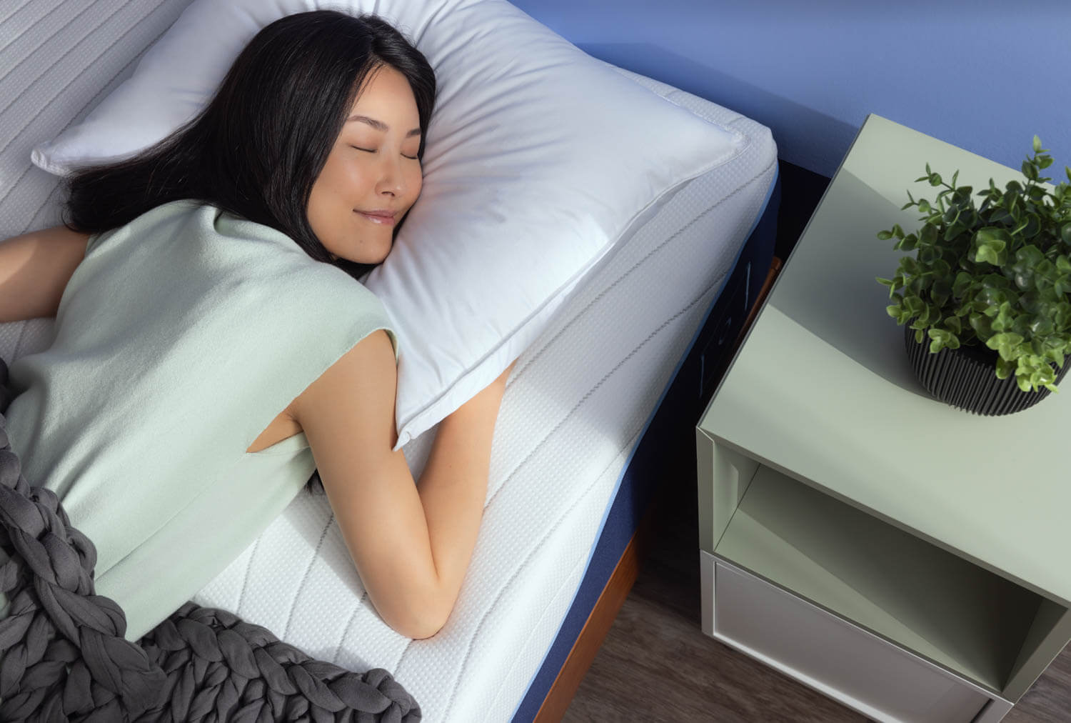 Woman peacefully sleeping on an Octave mattress